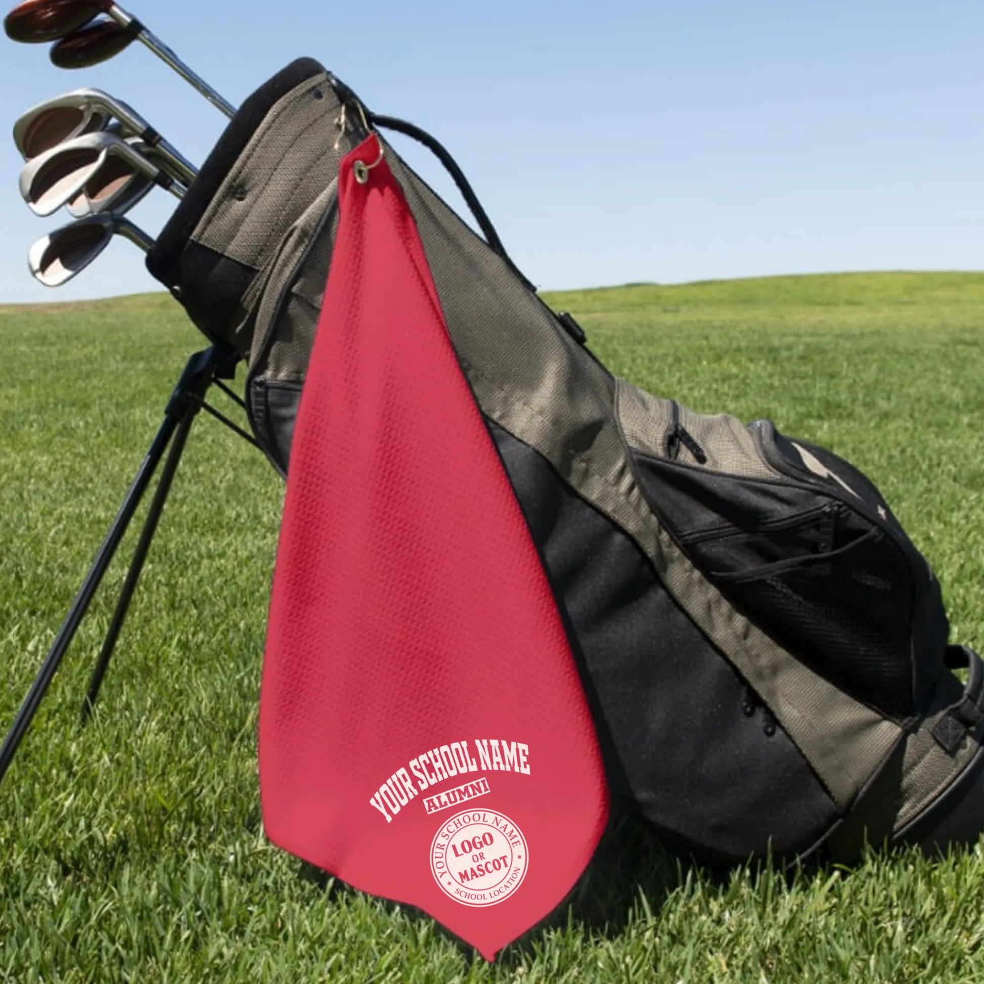 A classic black custom alumni golf towel, a perfect and practical gift for class reunions or alumni golf tournaments.