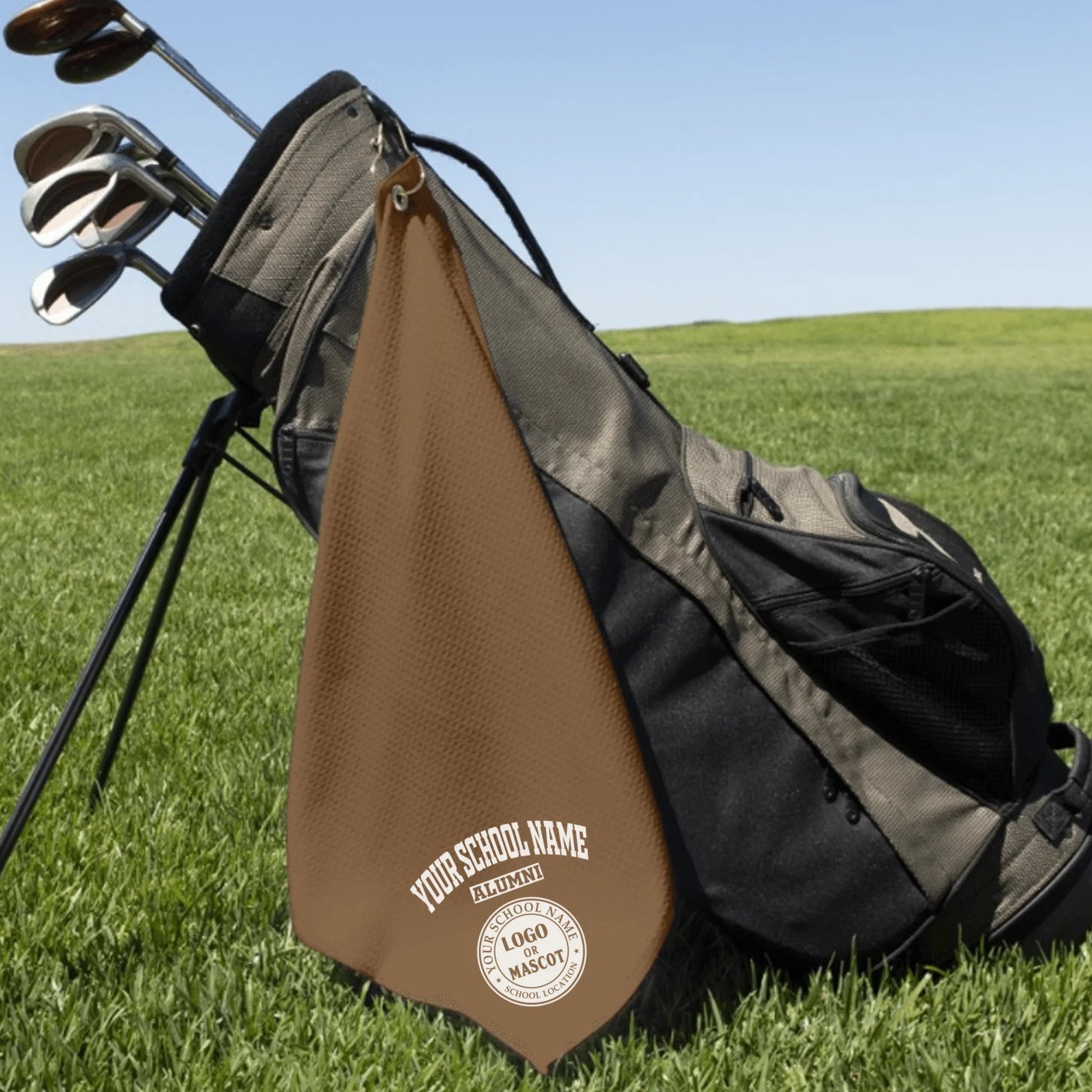 A classic black custom alumni golf towel, a perfect and practical gift for class reunions or alumni golf tournaments.