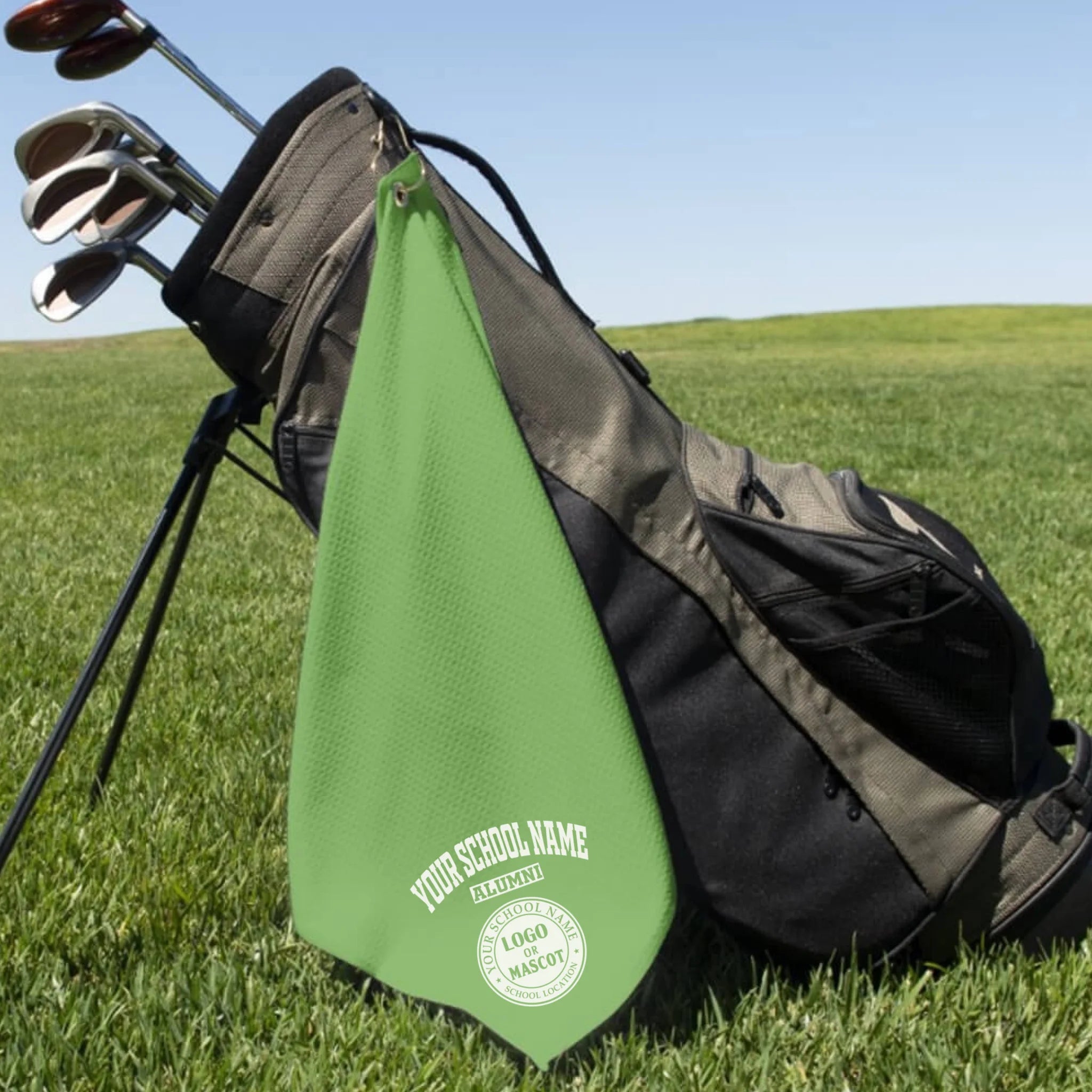 A classic black custom alumni golf towel, a perfect and practical gift for class reunions or alumni golf tournaments.