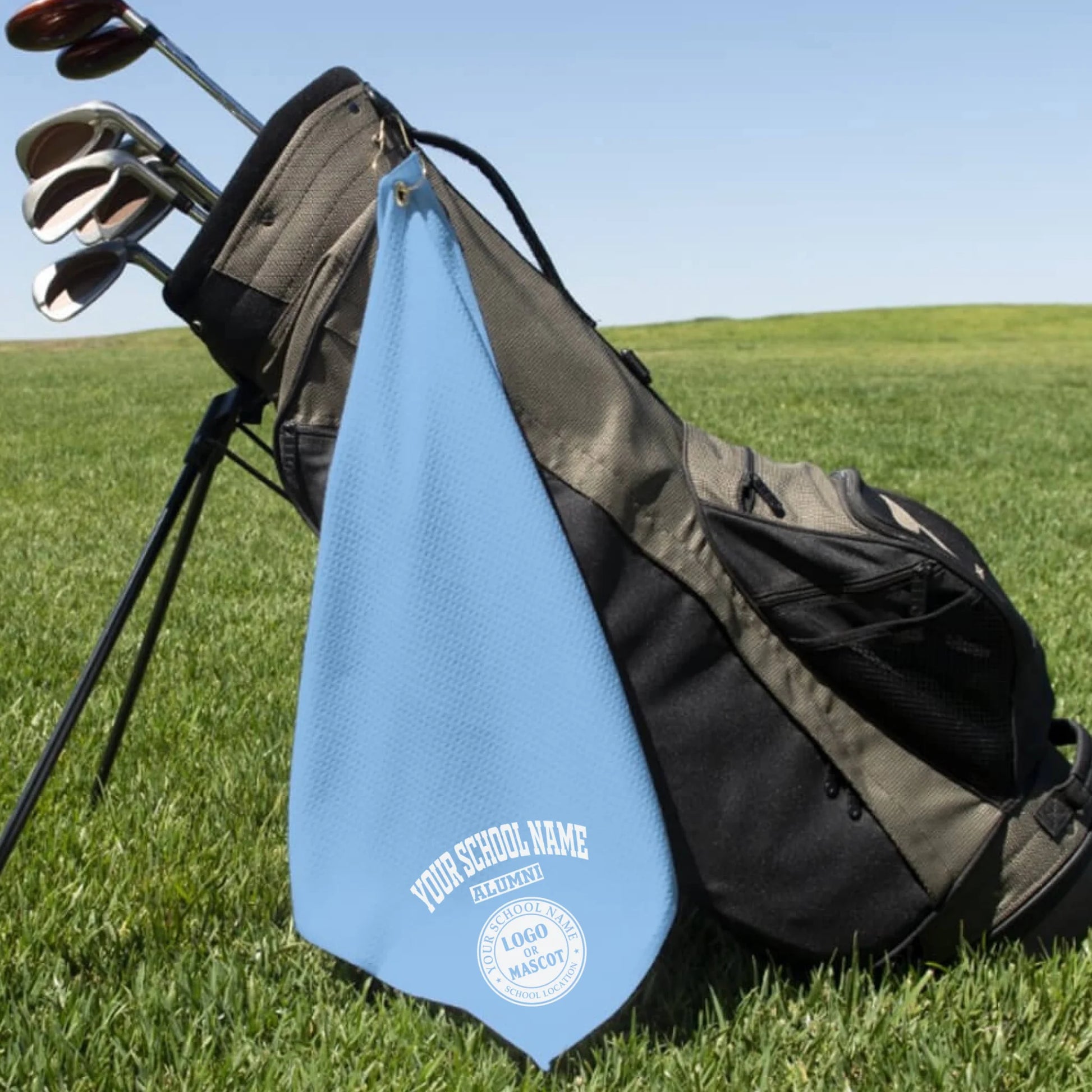 A classic black custom alumni golf towel, a perfect and practical gift for class reunions or alumni golf tournaments.