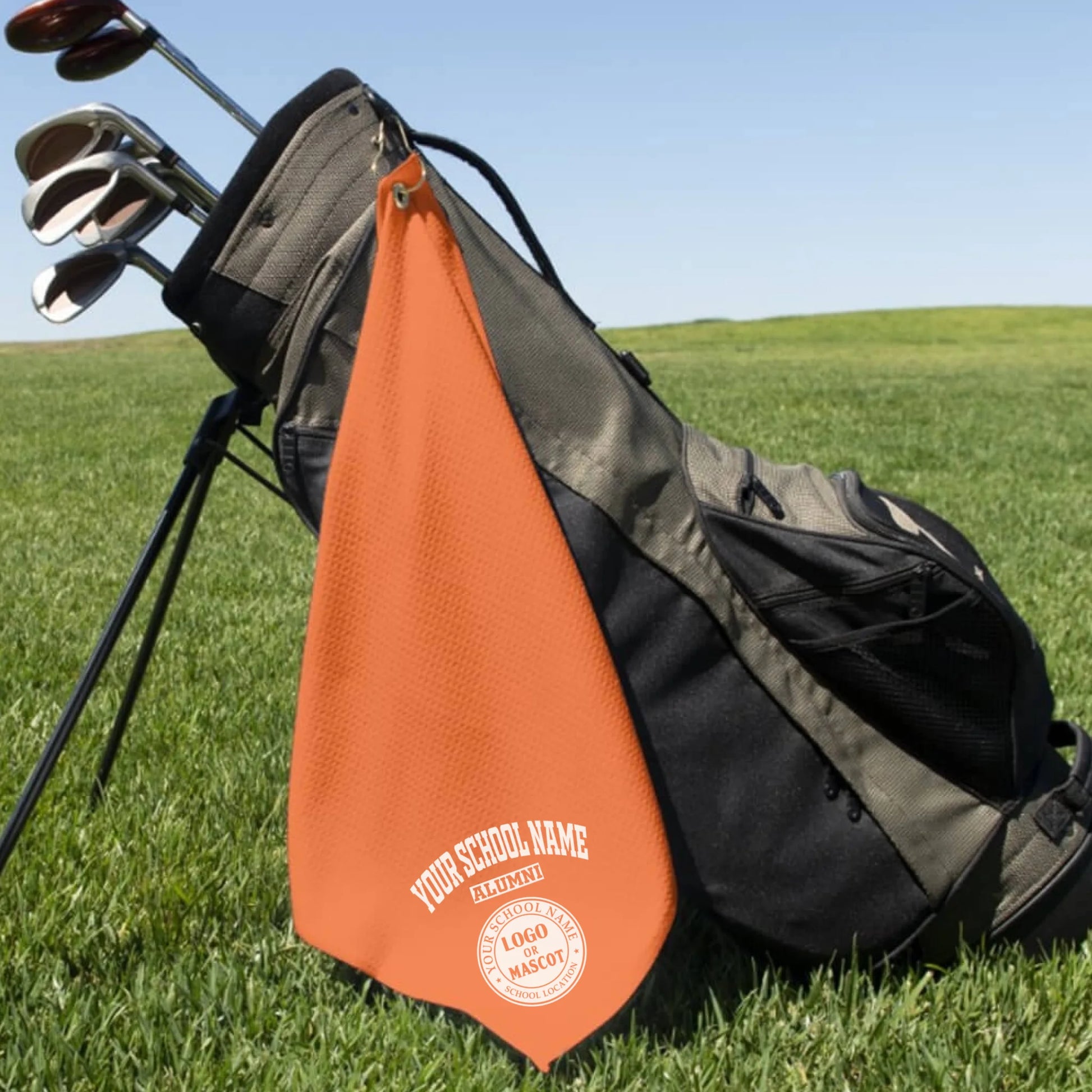 A classic black custom alumni golf towel, a perfect and practical gift for class reunions or alumni golf tournaments.