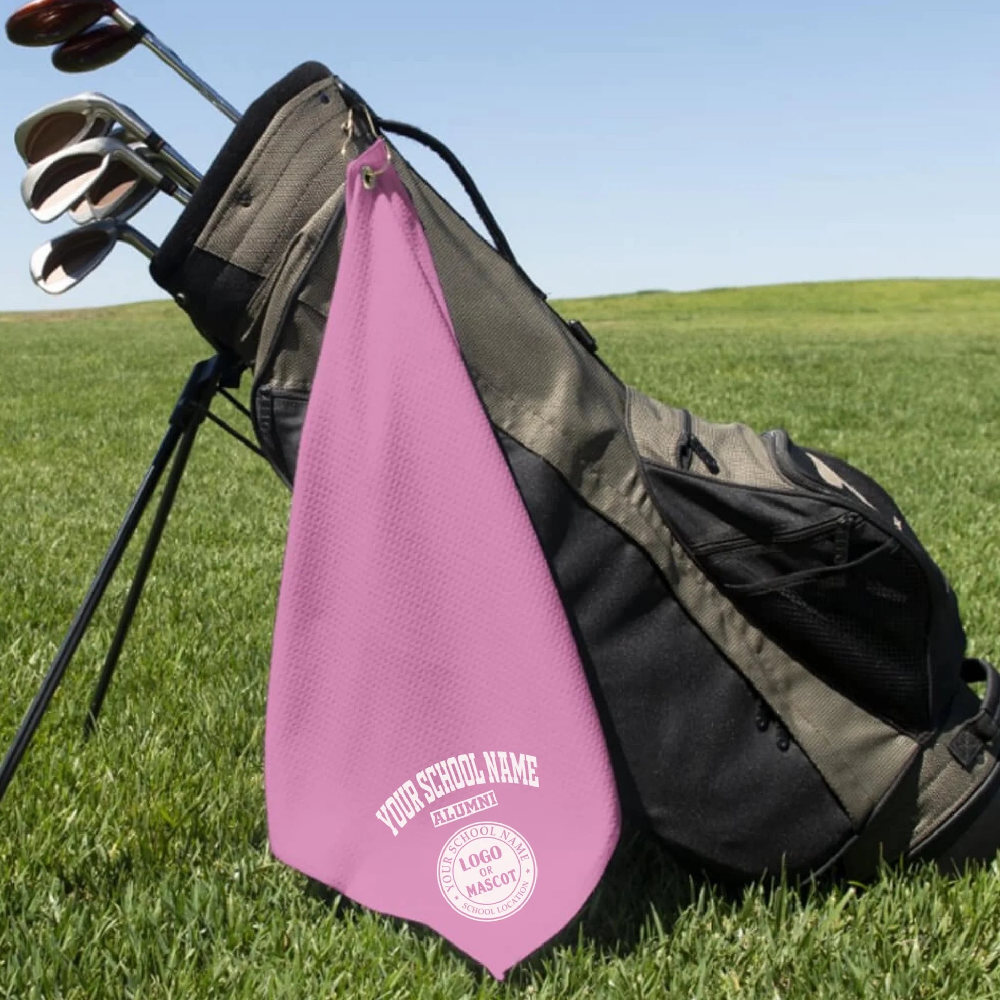 A classic black custom alumni golf towel, a perfect and practical gift for class reunions or alumni golf tournaments.