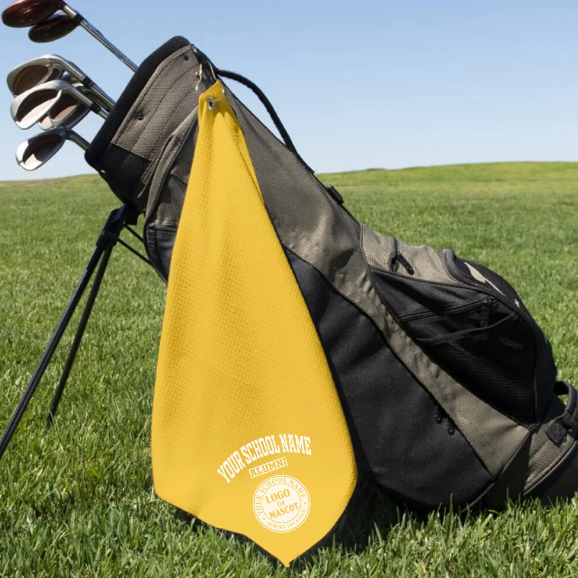 A classic black custom alumni golf towel, a perfect and practical gift for class reunions or alumni golf tournaments.