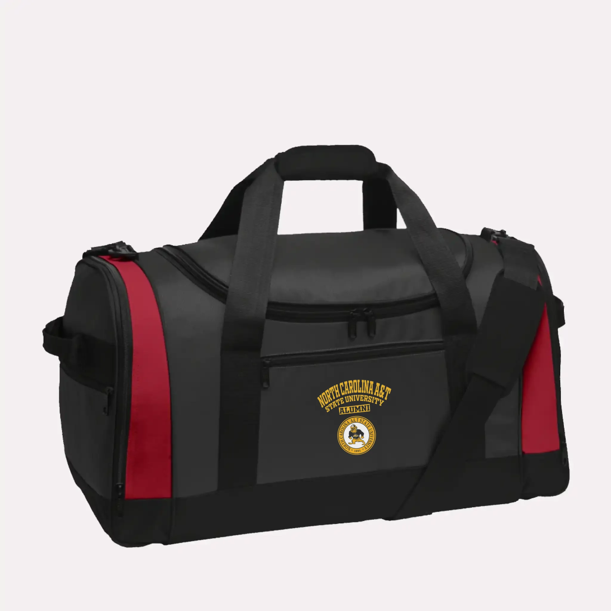 A vibrant red personalized graduation gift: the Voyager alumni duffel bag with a custom school emblem.