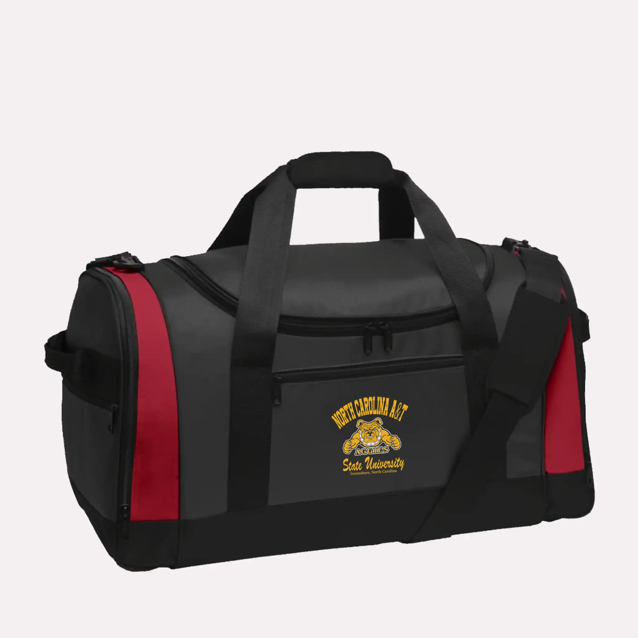 A vibrant red personalized graduation gift: the Voyager alumni duffel bag with a custom school emblem.